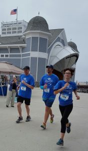 Runners run past the Sea Shell Stage in Hampton Beach