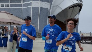 Runners run past the Sea Shell Stage in Hampton Beach