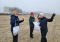 Volunteers at a winter beach cleanup at Hampton Beach