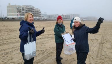 Volunteers at a winter beach cleanup at Hampton Beach