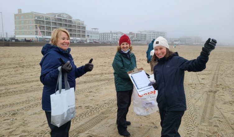 Volunteers at a winter beach cleanup at Hampton Beach